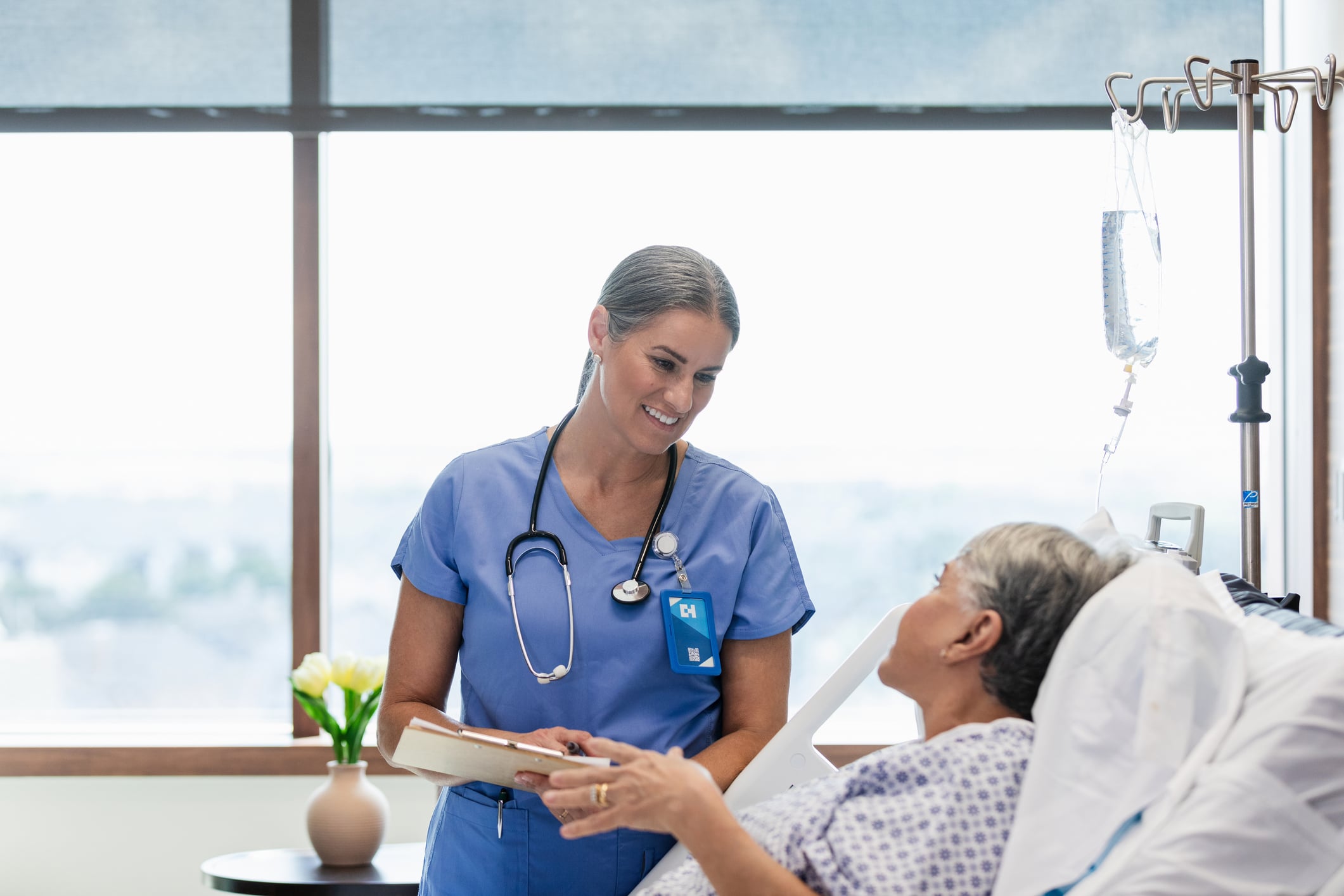 Nurse talks with patient